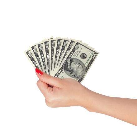 American dollars in a women hand isolated on white backgroundの写真素材