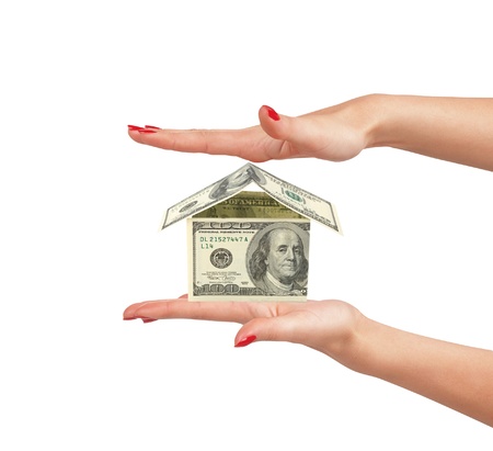 dollar house on woman hand isolated on white backgroundの写真素材