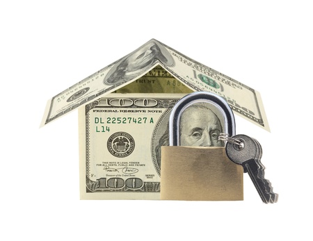 Dollar house and lock with keys isolated on white. Financial conceptの写真素材