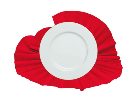 white plate on a red cloth isolated on whiteの写真素材
