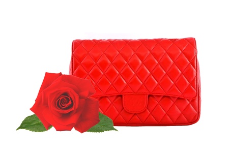 Red women bag and red rose isolated on white backgroundの写真素材