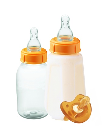 baby milk bottles and dummy isolated on white backgroundの写真素材