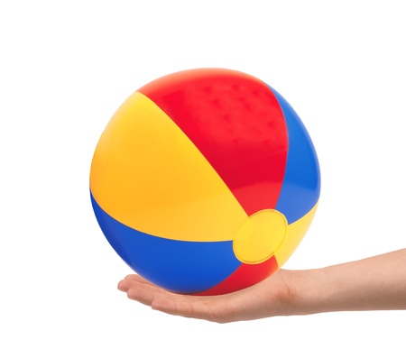 bright inflatable ball in hand isolated on white backgroundの写真素材
