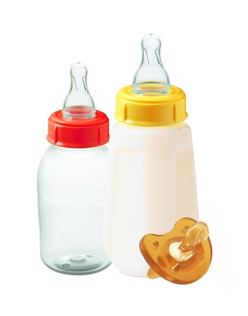 baby milk bottles and dummy isolated on white backgroundの写真素材