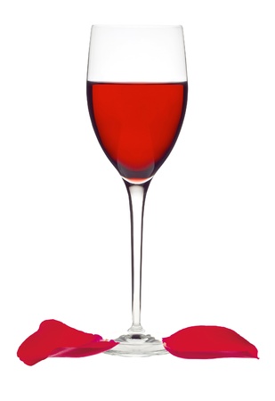 Classic Glass of Red Wine and rose petals isolated on a white backgroundの写真素材