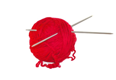 Red knittings yarn isolated on whiteの写真素材