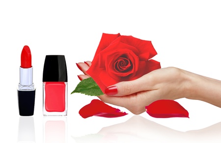 rose in woman hand, red nail polish and lipstick isolated on white background の写真素材