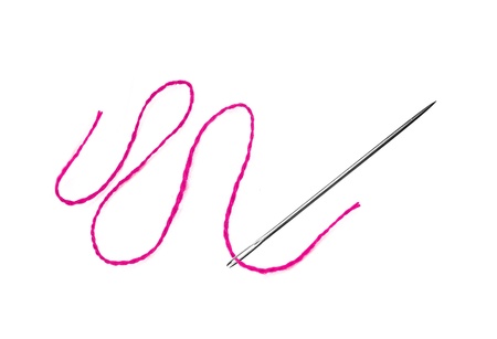 Red thread and needle isolated on whiteの写真素材