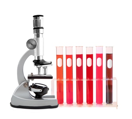 Medical test tubes with blood in holder and microscope on white backgroundの写真素材