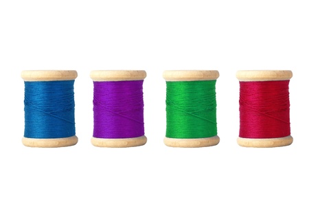 Few color bobbins isolated on white backgroundの写真素材