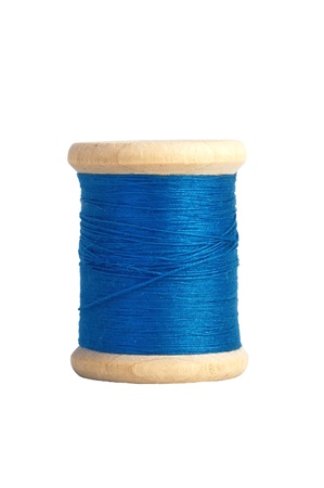 blue thread bobbin isolated on white backgroundの写真素材