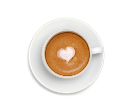 Latte coffee with heart symbol isolated on white backgroundの写真素材