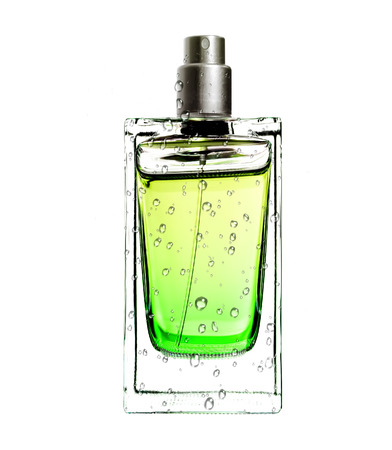 men's perfume in beautiful bottle in water drops isolated on white の写真素材