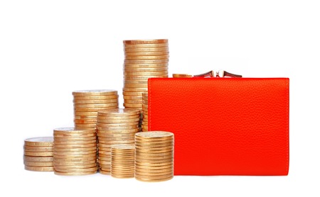 Red purse and coins isolated on white backgroundの写真素材