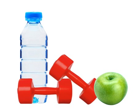 red dumbbells fitness, green apple and bottle of water isolated on whiteの写真素材