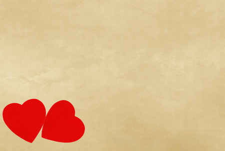 red hearts on vintage paper background with copyspaceの写真素材