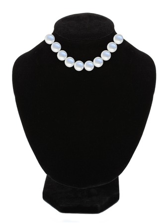 Pearl necklace on black mannequin isolated on white backgroundの写真素材
