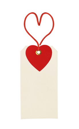 cardboard tag with red heart ribbon isolated on white backgroundの写真素材