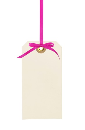 cardboard tag with pink ribbon and bow isolated on white backgroundの写真素材