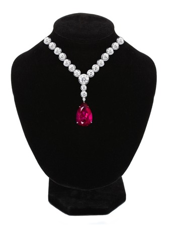 Diamond and ruby necklace on black mannequin isolated on white backgroundの写真素材