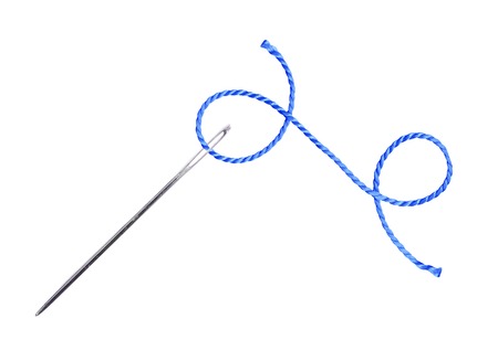 Blue thread and needle isolated on white backgroundの写真素材