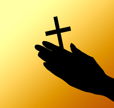 female hands with crucifix over brown の写真素材