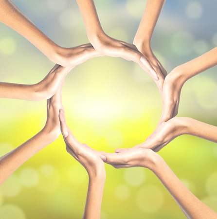 Human hands making circle on bright backgroundの写真素材