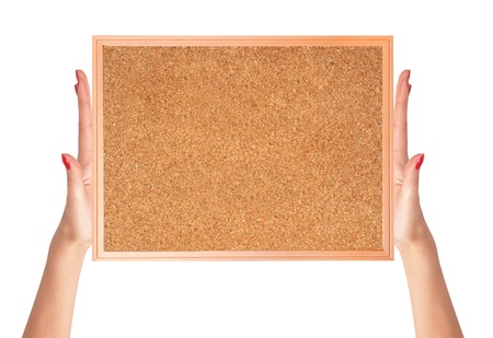 cork-board in woman hands isolated on white backgroundの写真素材