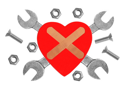 Heart and tools. Concept: Renovation of heart. Isolated on whiteの写真素材