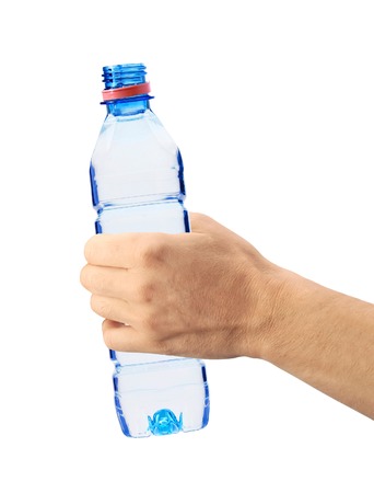 Human hand holding a bottle of water isolated on whiteの写真素材