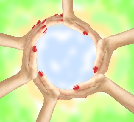 Human hands making circle on bright backgroundの写真素材