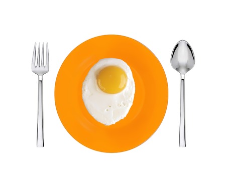 Scrambled eggs with on orange plate with spoon and fork  isolated on whiteの写真素材