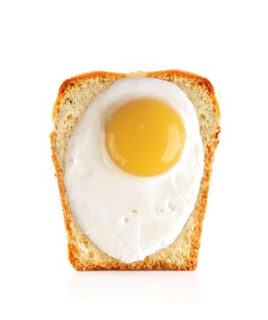 Scrambled eggs on bread isolated on whiteの写真素材