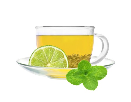 Transparent cup of green tea with lime and mint isolated on white backgroundの写真素材