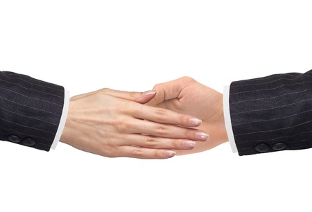 Women's hand goes to the man's hand isolated on white backgroundの写真素材