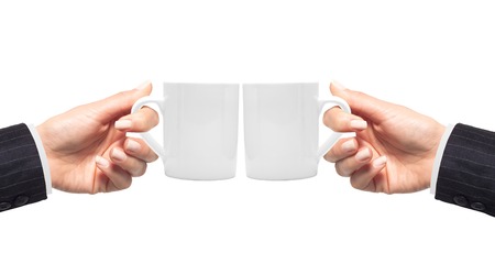 Woman hand with white cup of coffee isolated on whiteの写真素材