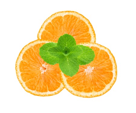 fresh juicy orange slices and mint herb isolated on white backgroundの写真素材