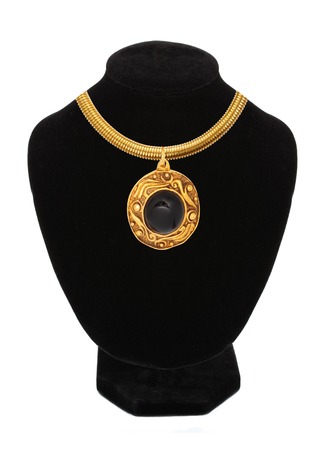 beautiful golden necklace on mannequin isolated on whiteの写真素材