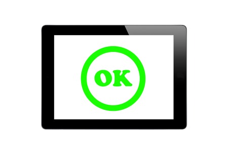 Black Touch Screen Tablet and sing ok isolated on white backgroundの写真素材