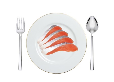 red fish on the plate isolated on whiteの写真素材