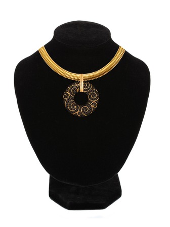 beautiful golden necklace on mannequin isolated on whiteの写真素材