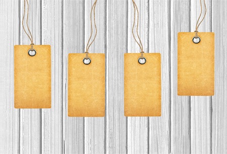 Brown tags on wooden backgroundの写真素材