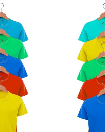 T-shirts on hangers close-up over whiteの写真素材