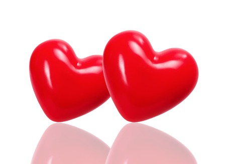 Red hearts on light backgroundの写真素材