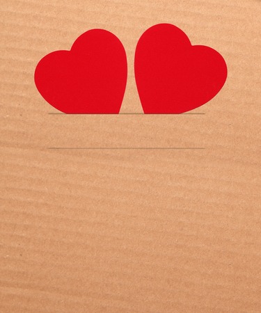 Paper hearts on brown background, close upの写真素材