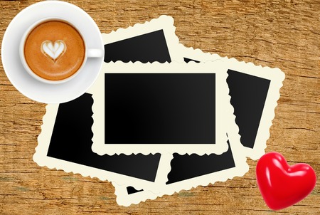 Film Vintage empty photo cards and coffee cup on wood backgroundの写真素材