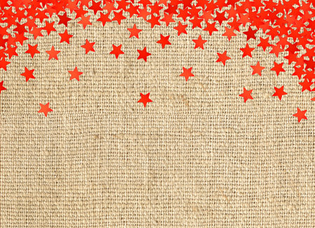 Red stars on linen texture backgroundの写真素材