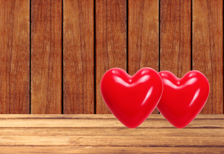 Red hearts on the wooden backgroundの写真素材