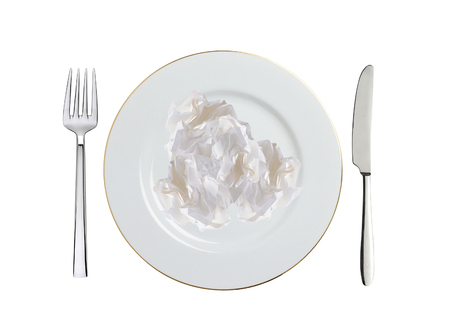 crumpled paper on white plate, spoon and fork isolated on whiteの写真素材
