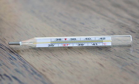 Thermometer on wooden tableの写真素材
